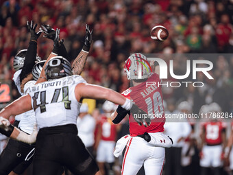 Wisconsin Badgers quarterback Braedyn Locke #18 attempts a pass against the Oregon Ducks at Camp Randall Stadium in Madison, Wisconsin, on N...