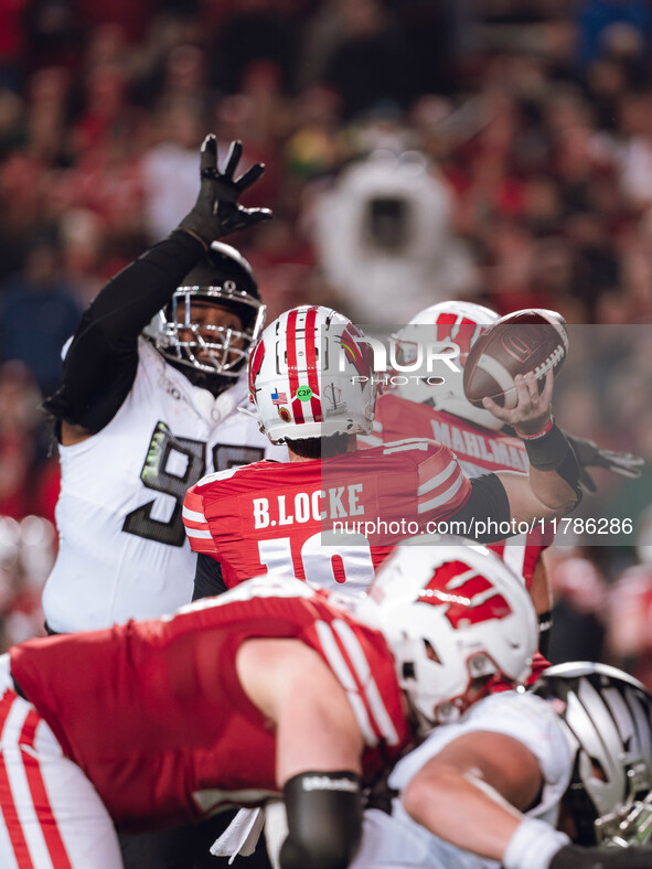 Wisconsin Badgers quarterback Braedyn Locke #18 attempts a pass against the Oregon Ducks at Camp Randall Stadium in Madison, Wisconsin, on N...