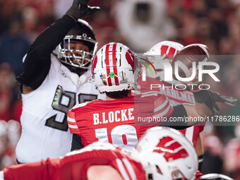 Wisconsin Badgers quarterback Braedyn Locke #18 attempts a pass against the Oregon Ducks at Camp Randall Stadium in Madison, Wisconsin, on N...