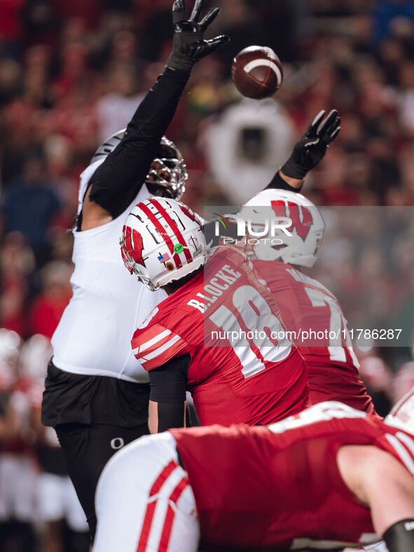 Wisconsin Badgers quarterback Braedyn Locke #18 attempts a pass against the Oregon Ducks at Camp Randall Stadium in Madison, Wisconsin, on N...