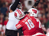 Wisconsin Badgers quarterback Braedyn Locke #18 attempts a pass against the Oregon Ducks at Camp Randall Stadium in Madison, Wisconsin, on N...