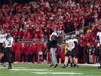 Oregon head coach Dan Lanning celebrates with his team as the Oregon Ducks seal the game with an interception late in the 4th quarter agains...