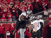 Oregon head coach Dan Lanning celebrates with his team as the Oregon Ducks seal the game with an interception late in the 4th quarter agains...