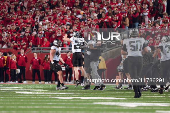 Oregon head coach Dan Lanning celebrates with his team as the Oregon Ducks seal the game with an interception late in the 4th quarter agains...