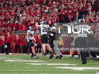 Oregon head coach Dan Lanning celebrates with his team as the Oregon Ducks seal the game with an interception late in the 4th quarter agains...