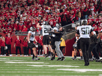 Oregon head coach Dan Lanning celebrates with his team as the Oregon Ducks seal the game with an interception late in the 4th quarter agains...