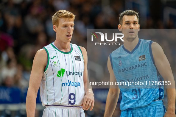 Alberto Diaz of Unicaja Malaga and Nikola Radicevic of Morabanc Andorra compete for the ball during the Liga Endesa 2024-2025 match between...