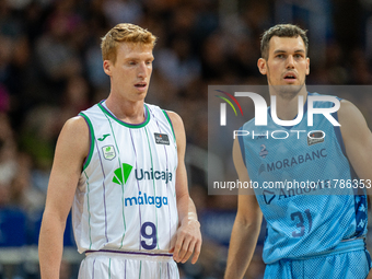 Alberto Diaz of Unicaja Malaga and Nikola Radicevic of Morabanc Andorra compete for the ball during the Liga Endesa 2024-2025 match between...