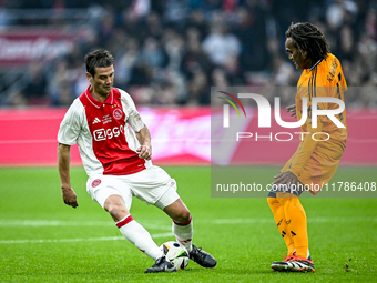 AFC Ajax Amsterdam legend Cristian Chivu and Real Madrid CF legend Christian Karembeu participate in the match between Ajax Legends and Real...