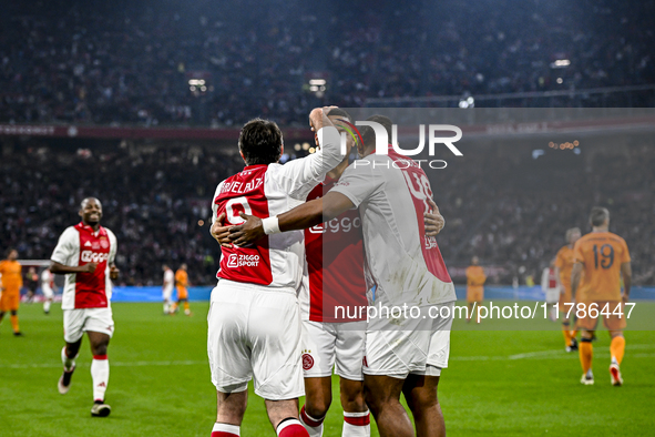 AFC Ajax Amsterdam legend players Shota Arveladze, Ricardo van Rhijn, and Ryan Babel celebrate a goal during the match between Ajax Legends...