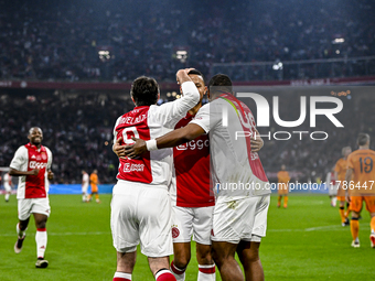 AFC Ajax Amsterdam legend players Shota Arveladze, Ricardo van Rhijn, and Ryan Babel celebrate a goal during the match between Ajax Legends...