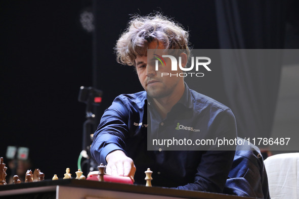 Norway's Magnus Carlsen plays on the last day of the 6th Tata Steel Chess India Rapid & Blitz Chess tournament in Kolkata, India, on Novembe...