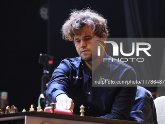 Norway's Magnus Carlsen plays on the last day of the 6th Tata Steel Chess India Rapid & Blitz Chess tournament in Kolkata, India, on Novembe...