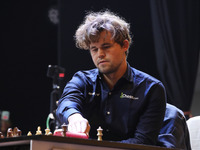 Norway's Magnus Carlsen plays on the last day of the 6th Tata Steel Chess India Rapid & Blitz Chess tournament in Kolkata, India, on Novembe...