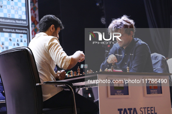 Norway's Magnus Carlsen plays against India's Vidit Gujrathi on the last day of the 6th Tata Steel Chess India Rapid & Blitz Chess tournamen...