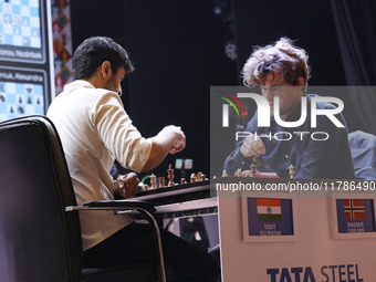 Norway's Magnus Carlsen plays against India's Vidit Gujrathi on the last day of the 6th Tata Steel Chess India Rapid & Blitz Chess tournamen...