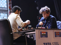 Norway's Magnus Carlsen plays against India's Vidit Gujrathi on the last day of the 6th Tata Steel Chess India Rapid & Blitz Chess tournamen...