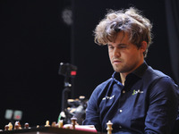 Norway's Magnus Carlsen plays on the last day of the 6th Tata Steel Chess India Rapid & Blitz Chess tournament in Kolkata, India, on Novembe...