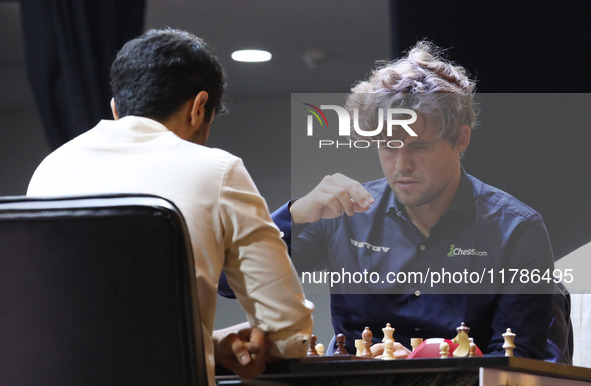 Norway's Magnus Carlsen plays against India's Vidit Gujrathi on the last day of the 6th Tata Steel Chess India Rapid & Blitz Chess tournamen...