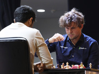 Norway's Magnus Carlsen plays against India's Vidit Gujrathi on the last day of the 6th Tata Steel Chess India Rapid & Blitz Chess tournamen...