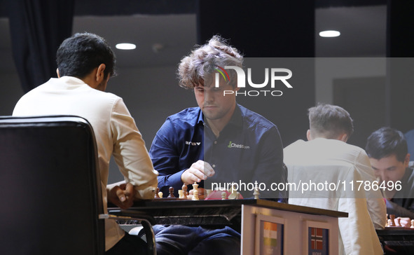 Norway's Magnus Carlsen plays against India's Vidit Gujrathi on the last day of the 6th Tata Steel Chess India Rapid & Blitz Chess tournamen...