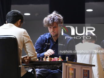 Norway's Magnus Carlsen plays against India's Vidit Gujrathi on the last day of the 6th Tata Steel Chess India Rapid & Blitz Chess tournamen...