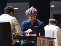 Norway's Magnus Carlsen plays against India's Vidit Gujrathi on the last day of the 6th Tata Steel Chess India Rapid & Blitz Chess tournamen...