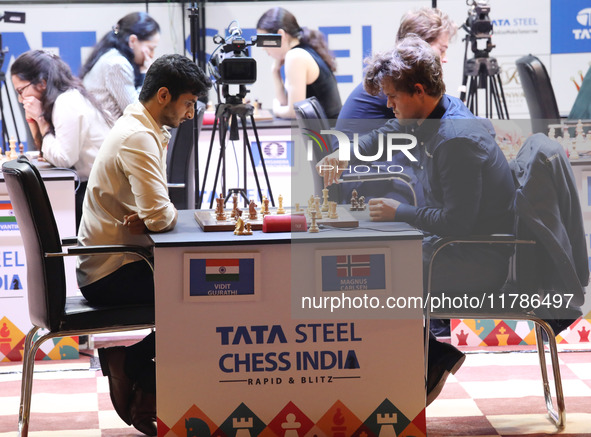 Norway's Magnus Carlsen plays against India's Vidit Gujrathi on the last day of the 6th Tata Steel Chess India Rapid & Blitz Chess tournamen...