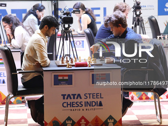 Norway's Magnus Carlsen plays against India's Vidit Gujrathi on the last day of the 6th Tata Steel Chess India Rapid & Blitz Chess tournamen...