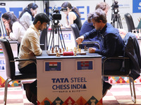 Norway's Magnus Carlsen plays against India's Vidit Gujrathi on the last day of the 6th Tata Steel Chess India Rapid & Blitz Chess tournamen...