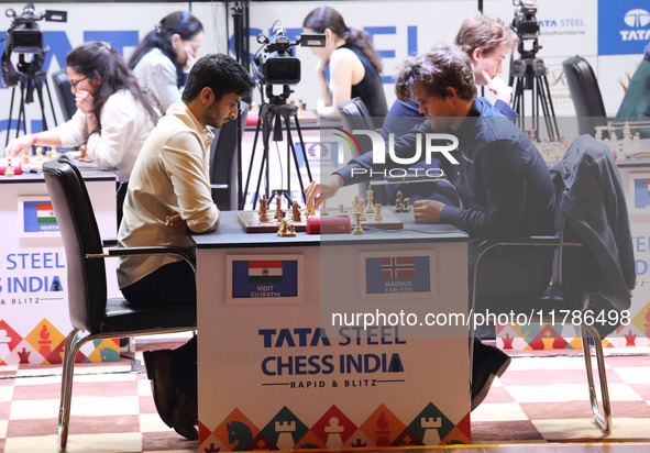 Norway's Magnus Carlsen plays against India's Vidit Gujrathi on the last day of the 6th Tata Steel Chess India Rapid & Blitz Chess tournamen...