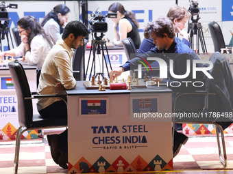 Norway's Magnus Carlsen plays against India's Vidit Gujrathi on the last day of the 6th Tata Steel Chess India Rapid & Blitz Chess tournamen...