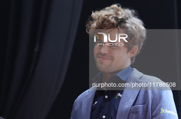 Norway's Magnus Carlsen gestures after winning the Tata Steel Chess India Tournament in Kolkata, India, on November 17, 2024. 