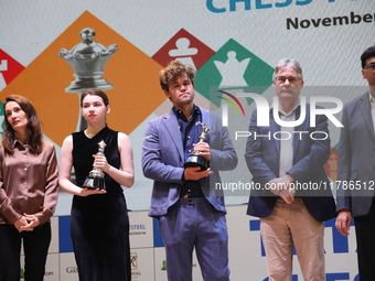 The Open Rapid and Blitz Chess winner Magnus Carlsen, women's blitz winner Kateryna Lagno, and women's rapid champion Aleksandra Goryachkina...