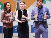 The Open Rapid and Blitz Chess winner Magnus Carlsen, women's blitz winner Kateryna Lagno, and women's rapid champion Aleksandra Goryachkina...