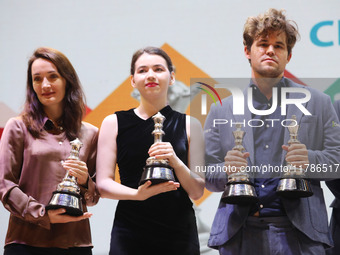 The Open Rapid and Blitz Chess winner Magnus Carlsen, women's blitz winner Kateryna Lagno, and women's rapid champion Aleksandra Goryachkina...