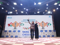 Women's blitz winner, Russian Kateryna Lagno, and women's rapid champion, Russian Aleksandra Goryachkina, pose for a picture with their trop...