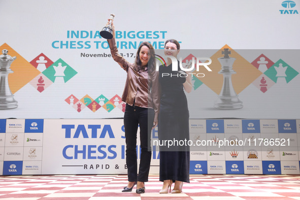 Women's blitz winner, Russian Kateryna Lagno, and women's rapid champion, Russian Aleksandra Goryachkina, pose for a picture with their trop...