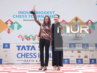 Women's blitz winner, Russian Kateryna Lagno, and women's rapid champion, Russian Aleksandra Goryachkina, pose for a picture with their trop...