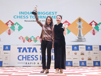 Women's blitz winner, Russian Kateryna Lagno, and women's rapid champion, Russian Aleksandra Goryachkina, pose for a picture with their trop...