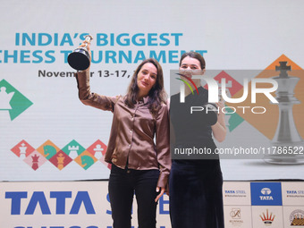 Women's blitz winner, Russian Kateryna Lagno, and women's rapid champion, Russian Aleksandra Goryachkina, pose for a picture with their trop...