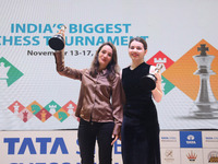 Women's blitz winner, Russian Kateryna Lagno, and women's rapid champion, Russian Aleksandra Goryachkina, pose for a picture with their trop...