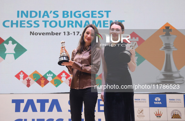 Women's blitz winner, Russian Kateryna Lagno, and women's rapid champion, Russian Aleksandra Goryachkina, pose for a picture with their trop...