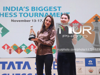 Women's blitz winner, Russian Kateryna Lagno, and women's rapid champion, Russian Aleksandra Goryachkina, pose for a picture with their trop...