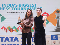 Women's blitz winner, Russian Kateryna Lagno, and women's rapid champion, Russian Aleksandra Goryachkina, pose for a picture with their trop...