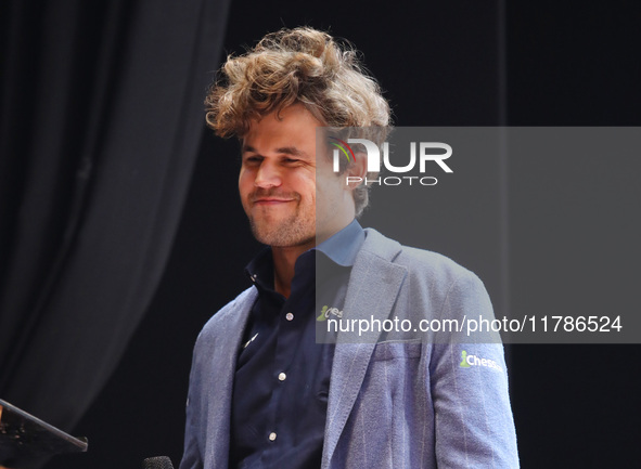 Norway's Magnus Carlsen gestures after winning the Tata Steel Chess India Tournament in Kolkata, India, on November 17, 2024. 