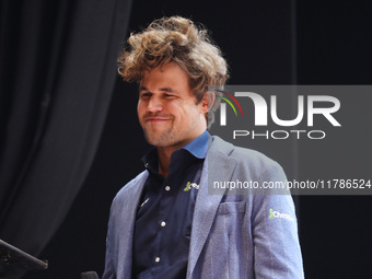 Norway's Magnus Carlsen gestures after winning the Tata Steel Chess India Tournament in Kolkata, India, on November 17, 2024. (