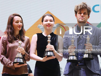 The Open Rapid and Blitz Chess winner Magnus Carlsen, women's blitz winner Kateryna Lagno, and women's rapid champion Aleksandra Goryachkina...