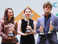 The Open Rapid and Blitz Chess winner Magnus Carlsen, women's blitz winner Kateryna Lagno, and women's rapid champion Aleksandra Goryachkina...