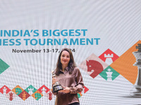 Woman blitz winner Russian Kateryna Lagno poses for a picture with her trophies at the Tata Steel Chess India Tournament in Kolkata, India,...